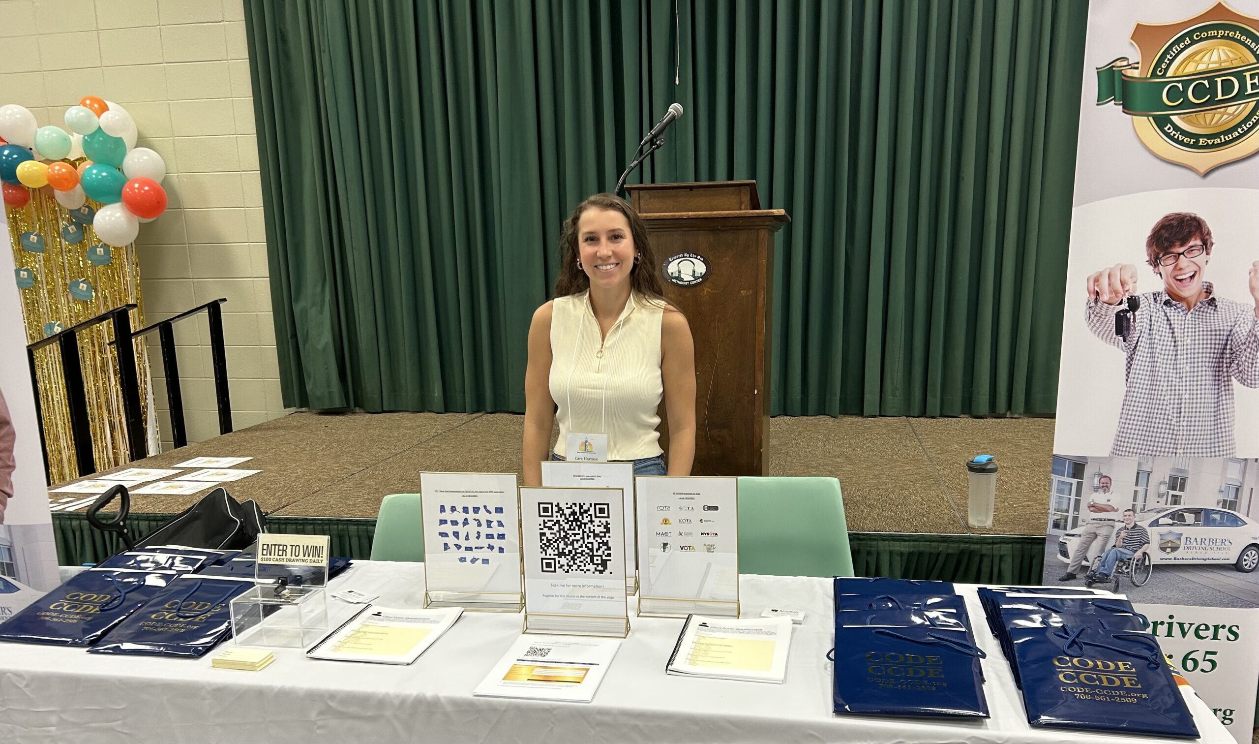 Cara Harman hosting an exhibitor booth on driving evaluations at the Georgia OT (GOTA) conference